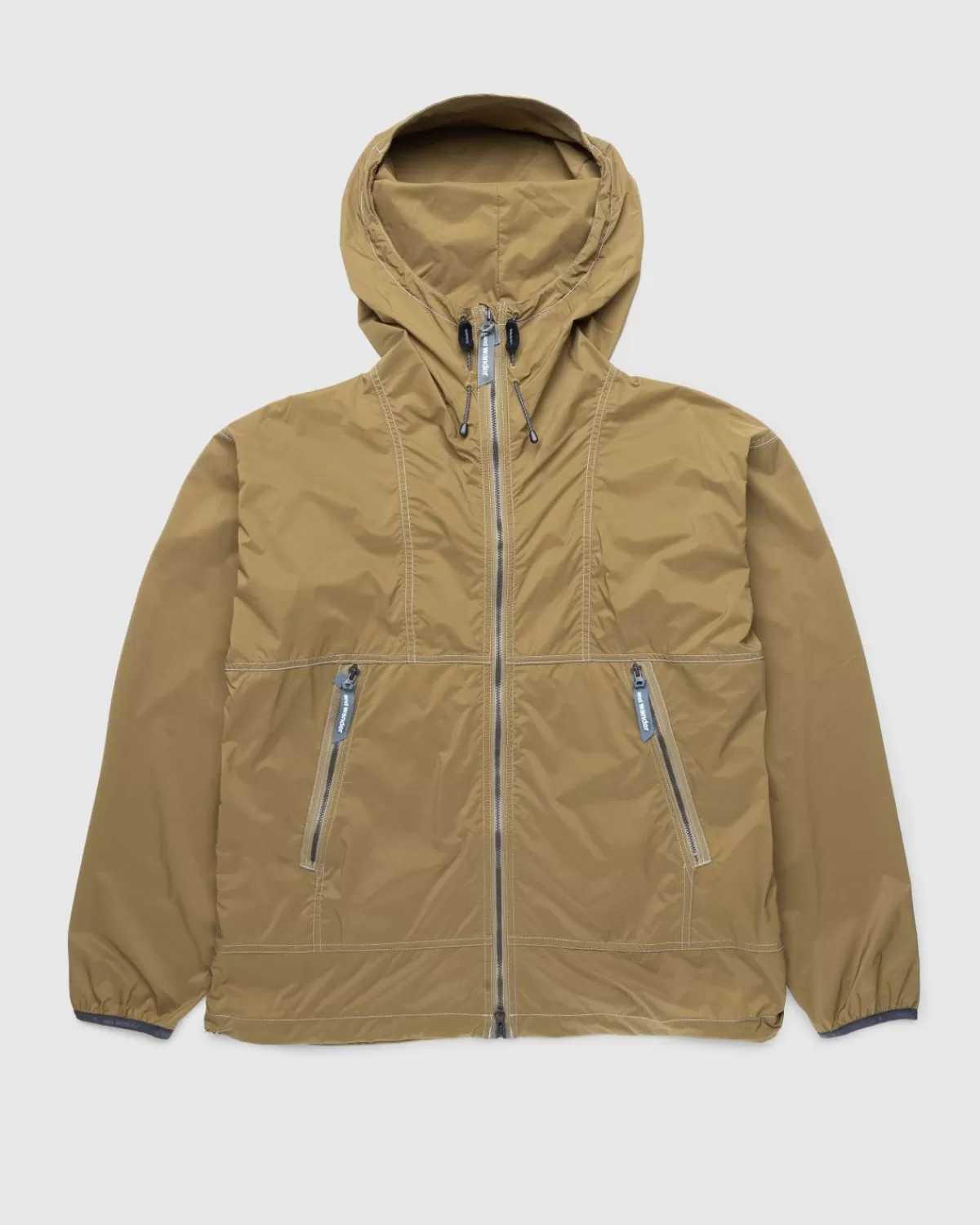 Bovenkleding^And Wander Pertex Windjack Beige